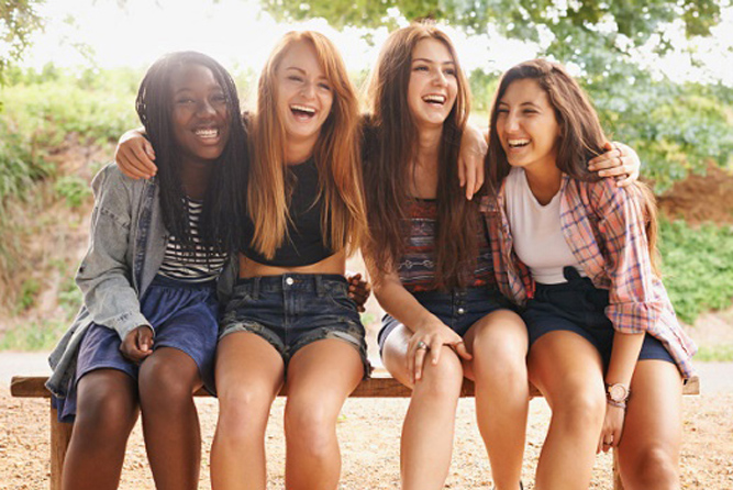 group of girls laughing together 