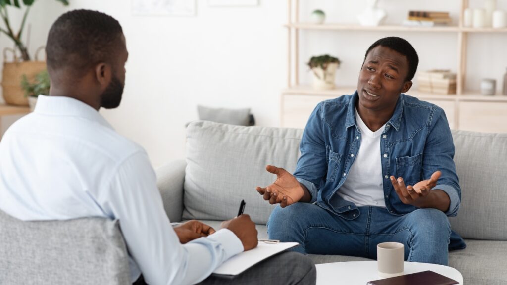 A man shares his experience with dependency during a personalized treatment session.