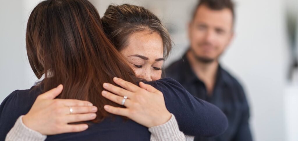 Woman hugging a loved one after opioid addiction treatment in Ohio.