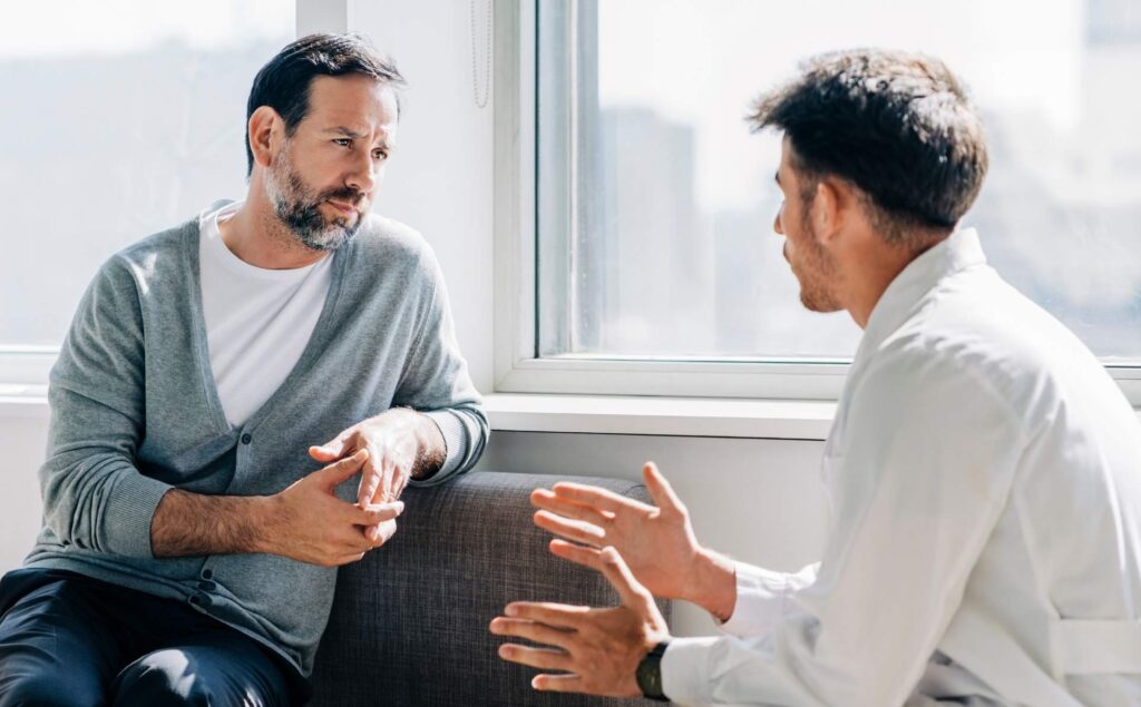 Executive speaking with a therapist.