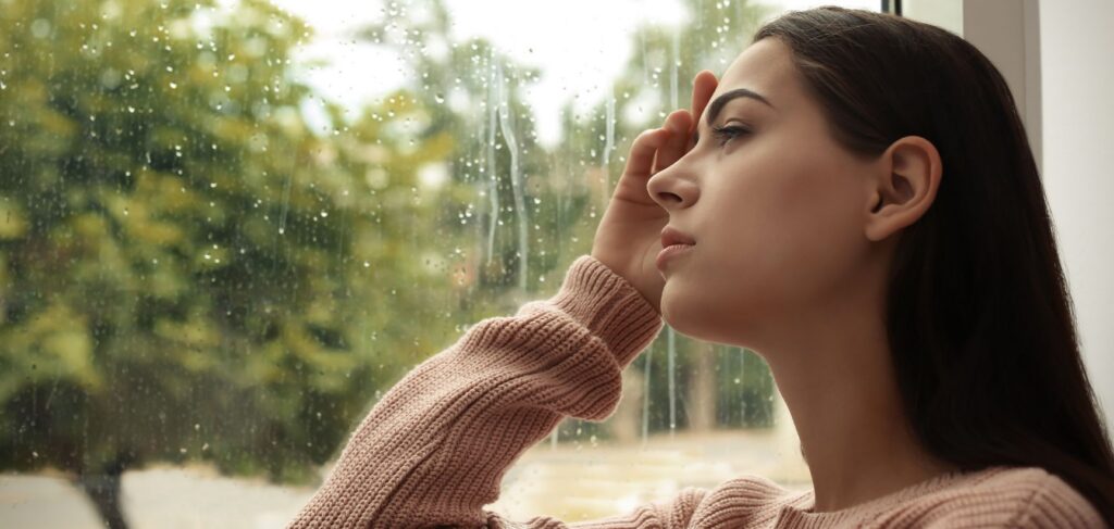 Woman in quiet moment during MDMA detox in Ohio.
