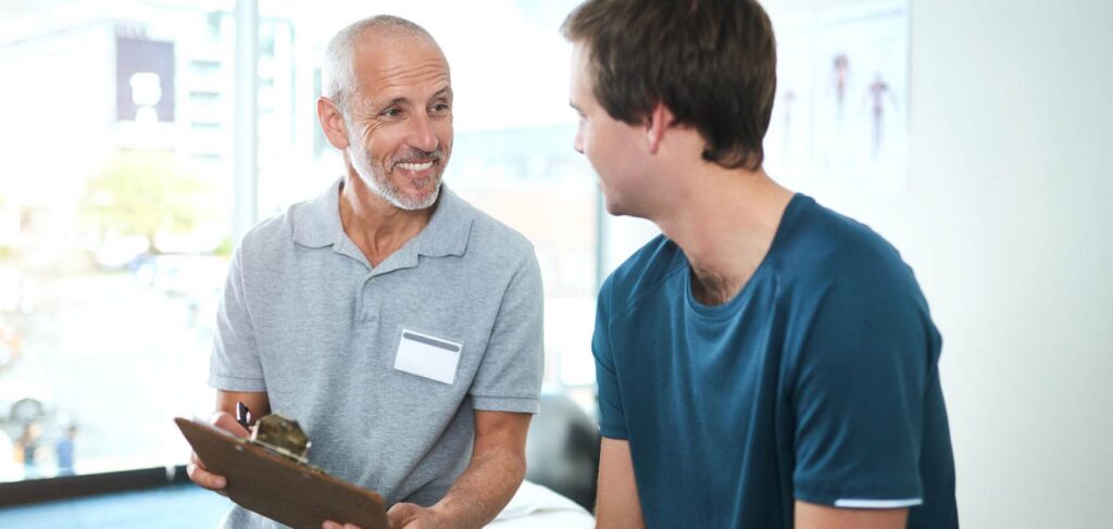 Professional providing support to a man in a partial hospitalization program in Columbus, Ohio.