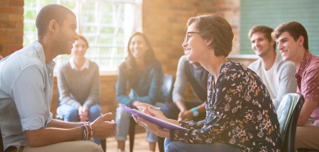 Therapist leading a group therapy session in a partial hospitalization program in Columbus, Ohio.